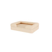Un letto per cani beige.
