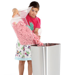 Girl empties bedding tray of the Qute.